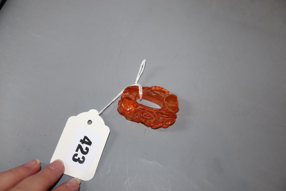 A Chinese carved amber pendant